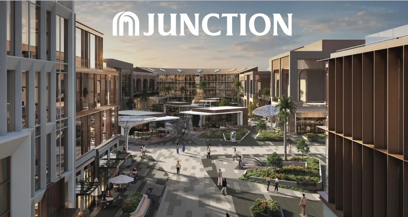 Landscaped plaza between Junction office buildings with cafés and shaded seating, West Cairo