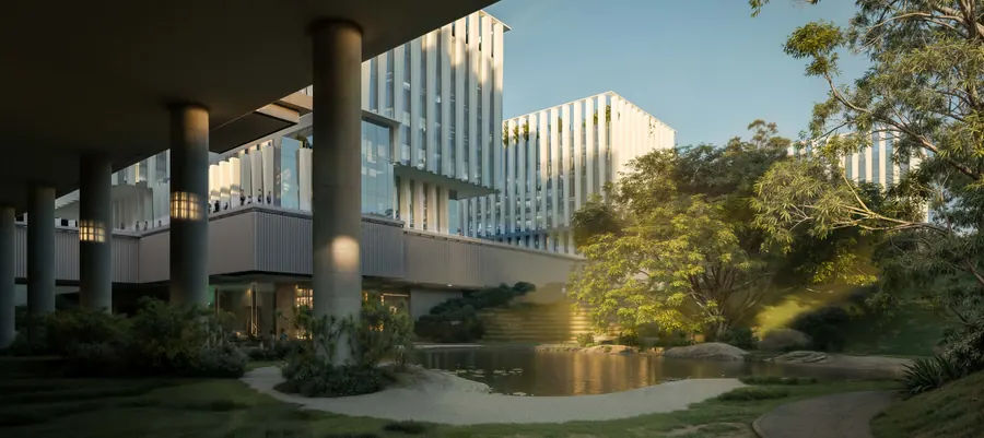W55 office buildings above a garden pond and shaded walkway